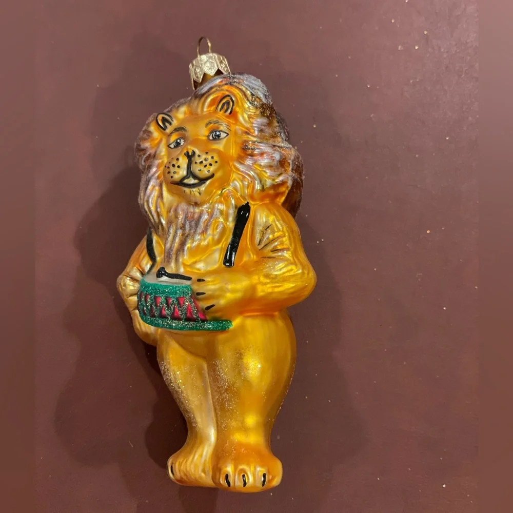Lion playing drums blown glass Christmas ornament